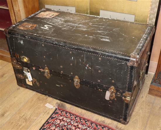 A 1920s leather and canvas covered travelling trunk / wardrobe W.105cm